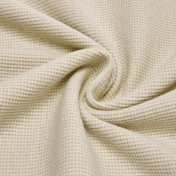 Kain Waffel Uniqo dengan pola waffle timbul yang rapi dan tekstur lembut, cocok untuk pakaian casual.